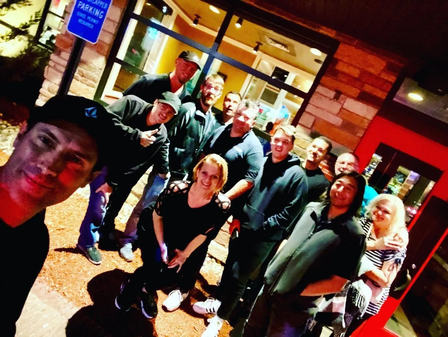 Susan and the production crew gathered outside at night