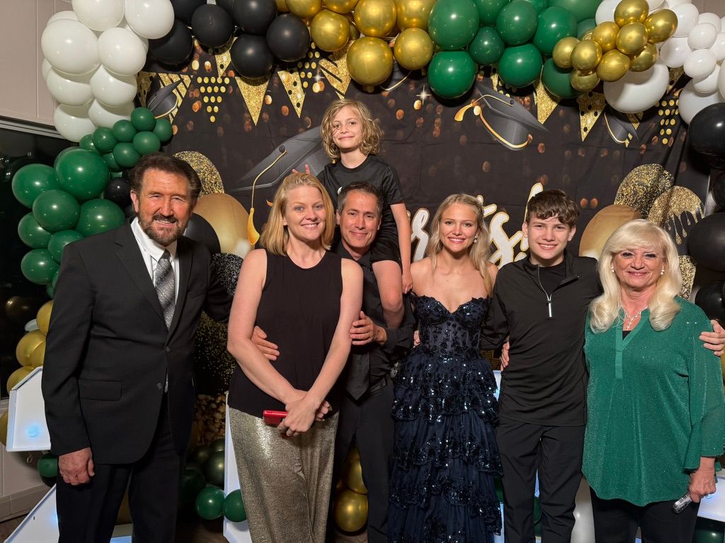 Family photo at a graduation celebration